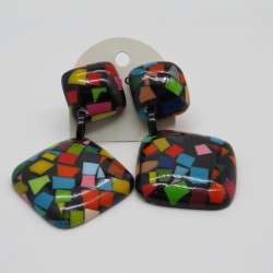 Colourful mosaic effect earrings, two round cornered resin squares link together on a black background by Marion Godart.